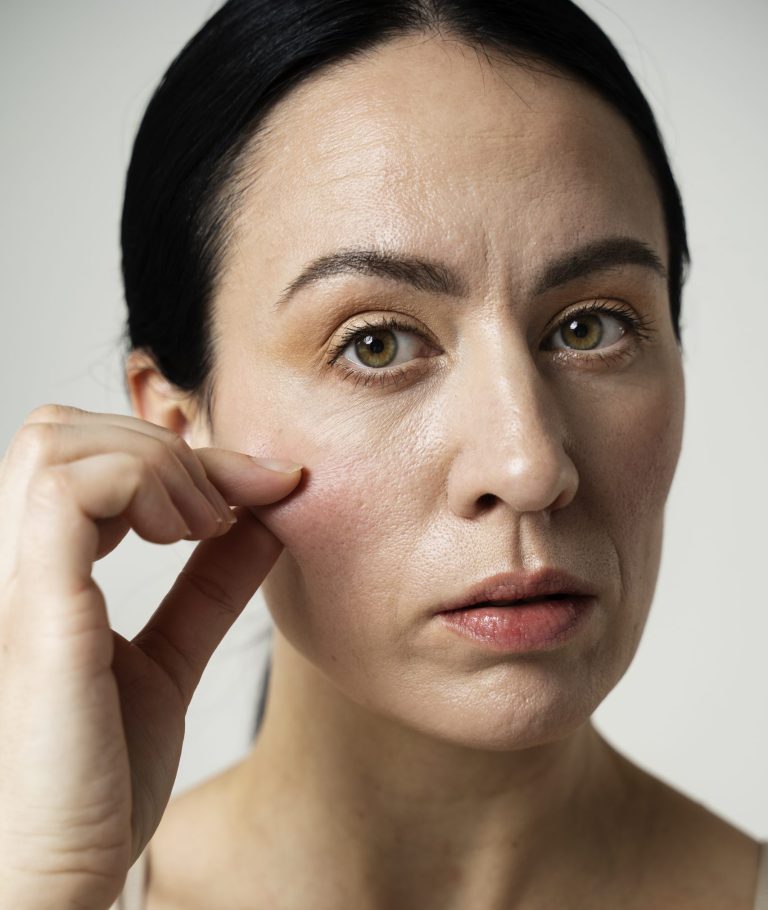 brunette-woman-holding-her-cheek
